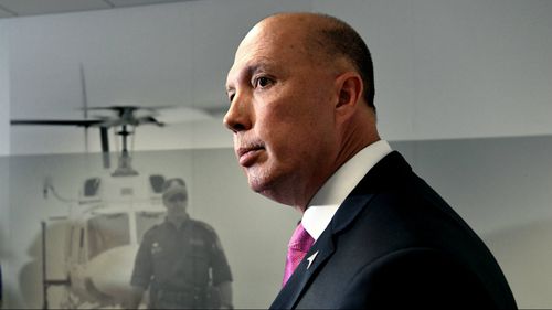 Mr Dutton, pictured at a press conference today, has threatened to expose Labor ministers.