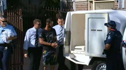 Police take Robert Strebeck into custody. Picture: 9NEWS