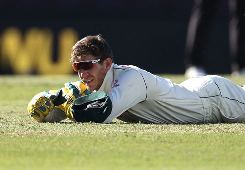 Tim Paine of Australia reacts after dropping a catch off Hanuma Vihari of India.