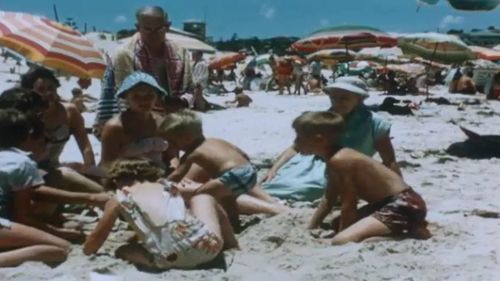 A day at the beach. Picture: State Library of Queensland Reel Rescue