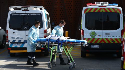  Medical transport workers prepare to enter the Epping Aged Care Home on July 29, 2020 in Melbourne, Australia. 