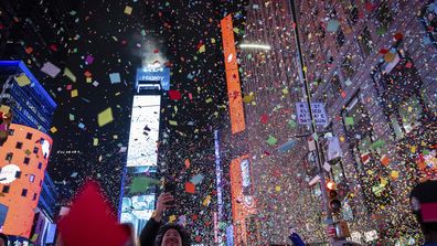 Revelers celebrate after the ball drops in New York&#x27;s Times Square, Wednesday, Jan. 1, 2025, in New York. (AP Photo/Stefan Jeremiah)