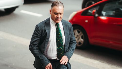 Former TV presenter Andrew OKeefe arrives at Downing Centre Local Court for his hearing on assault charges, Wednesday 1st of November 2023.  Photo: Dion Georgopoulos / The Sydney Morning Herald