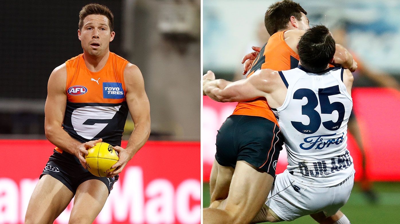 Toby Greene of the Giants hits Patrick Dangerfield of the Cats high in an attempt the fend off a tackle during the round 21 AFL match between Geelong Cats and Greater Western Sydney Giants at GMHBA Stadium on August 06, 2021 in Geelong, Australia. (Photo by Darrian Traynor/Getty Images)