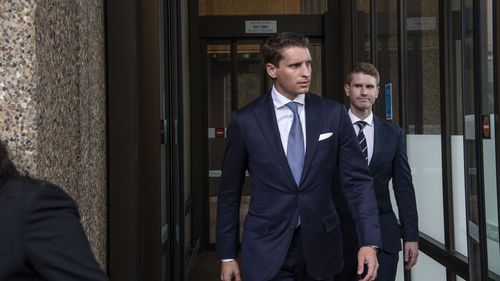 Andrew Hastie leaving Federal Court. 