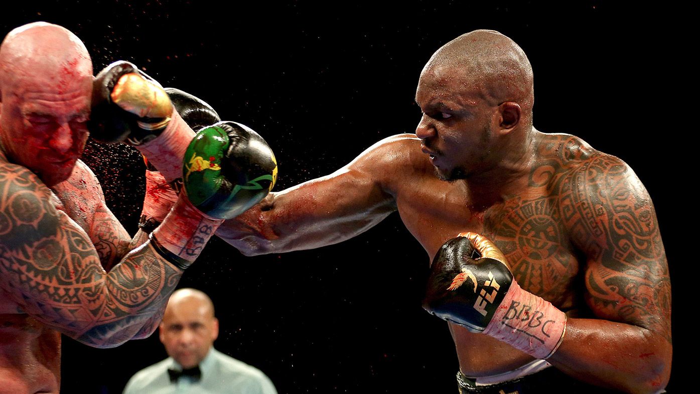 Dillian Whyte, right, sends a right to Lucas Browne in the WBC Silver Heavyweight Championship contest 