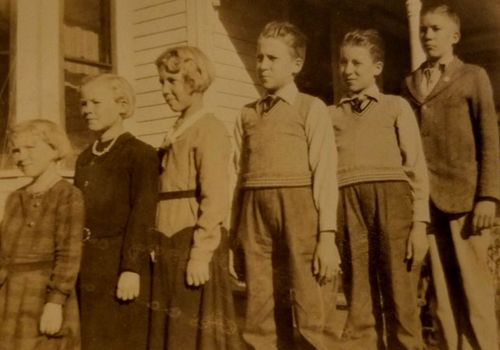 In this undated photo, provided by family member Susan Lawrence, the Pieper children, from left: MaryAnn, Leona, Ivona, twins Ludwig and Julius and Fred stand outside the family home in Nebraska. (AP).