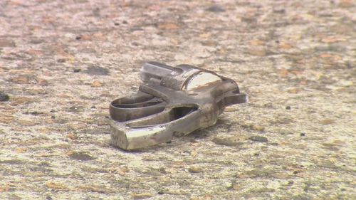 A man is accused of pointing a loaded revolver at a female police officer in Mermaid Waters, Gold Coast.