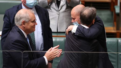 Josh Frydenberg hugs Greg Hunt after the latter's retirement speech.