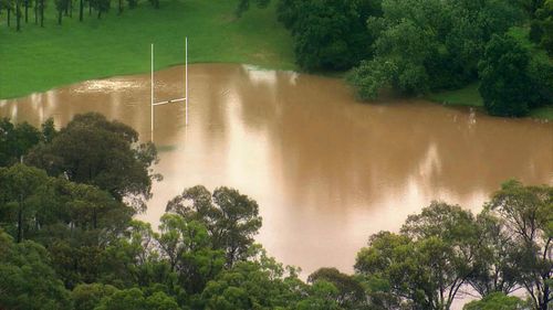 Fields are submerged by floodwaters in Sydney's south-west.