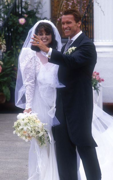 Actor Arnold Schwarzenegger with his new wife Maria Shriver outside St. Francis Xavier Church after their wedding on April 26, 1986 in Hyannis, Massachusetts.