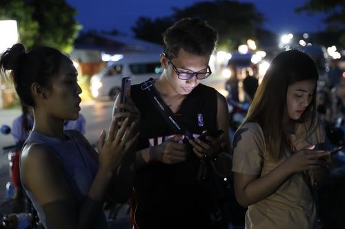 Friends and family wait for updates on the rescued boys' conditions. Picture: AP