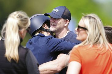 Zara Tindall hugs her husband Mike, on day two of the Badminton Horse Trials 2024 at the Badminton Estate in Badminton, England, Thursday, May 9, 2024 