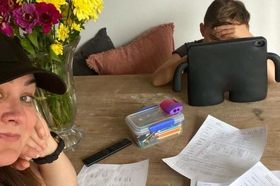 Michelle Bridges and son Axel doing homework