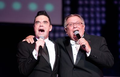 Robbie Williams and his dad Pete Conway perform at De Montfort Hall And Gardens on May 18, 2012 in Leicester, United Kingdom.