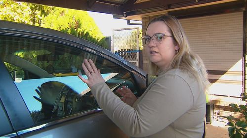 Sam Thompson has been left traumatised after the woman allegedly threw a brick at her car and headbutted her window. 