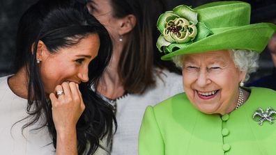 Meghan Markle and Queen Elizabeth laughing together. 