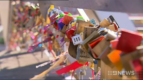 Lovers' locks saved from Victorian bridge