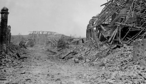 A shattered street in the village of Le Hamel in France shortly after the battle. (Photo: AWM). 