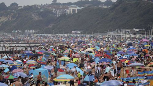 This beach in Bournemouth is packed with people during a particularly hot summer.