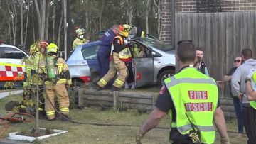 A woman has been charged after her car hit a man and crashed into a house in Schofields, Sydney.