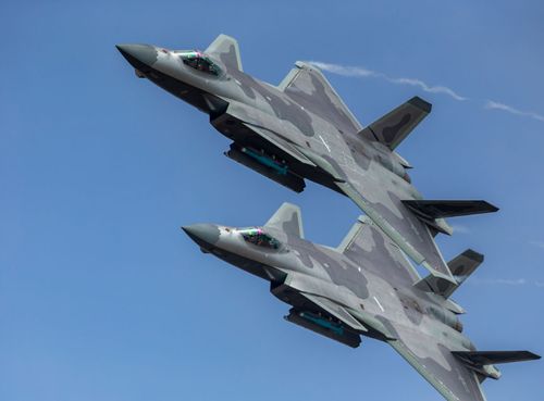 Two Chinese J-20 fighters flew over crowds at the Zuihai Air Show.