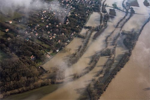 Record rainfall has pushed rivers over their banks across northeastern France in recent days. (AAP)