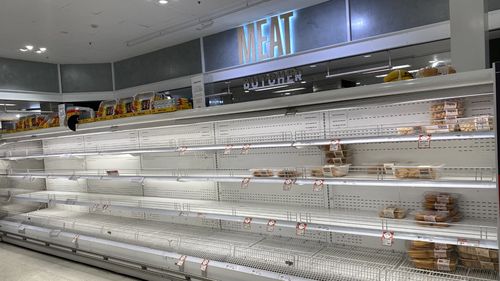 Empty supermarket shelves at Coles