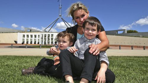 Danica Weeks, whose husband Paul was aboard Malaysia Airlines Flight 370, poses for a photo with her sons Lincoln, 4, front right and Jack,1, in 2015. Picture: AAP