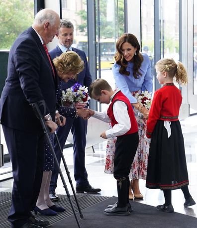 Princess Mary business conference blue shirt and floral skirt