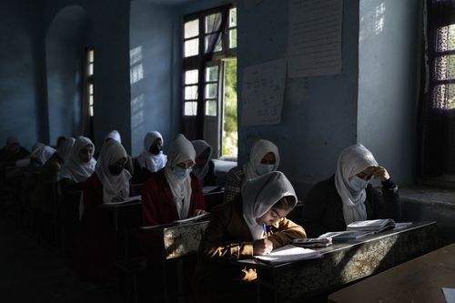 Afghan girls participate a lesson at Tajrobawai Girls High School, in Herat, Afghanistan, Thursday, November 25, 2021. 
