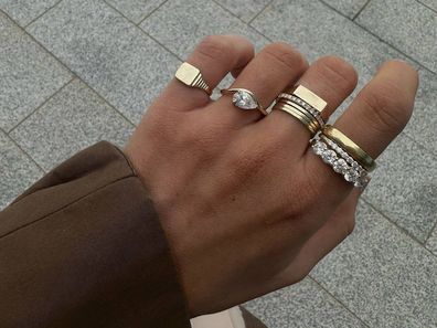 A stack of rings worn by Alana Maria Jewellery founder Alana Ellis.