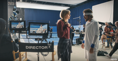 The Man wears merch in Taylor Swift's music video.