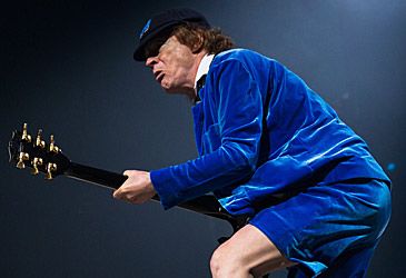 What line of Gibson guitars does Angus Young primarily perform with?