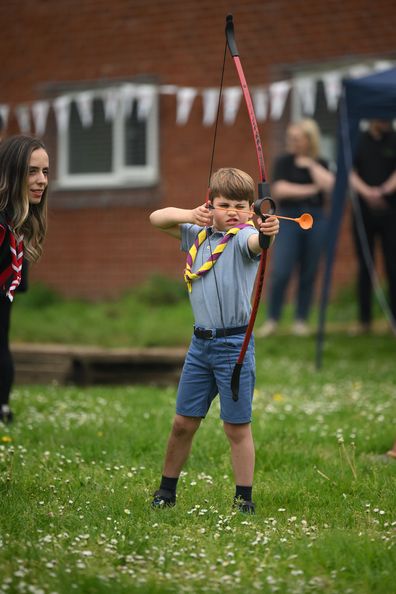 Prince Louis of Wales tries his hand at archery while taking part in the Big Help Out, during a visit to the 3rd Upton Scouts Hut in Slough on May 8, 2023