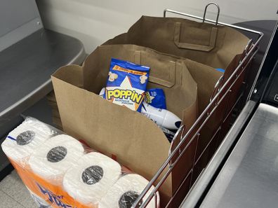 shopping bags at supermarket groceries coles woolworths aldi 