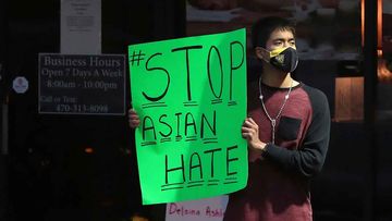 A demonstrator outside Youngs Asian Massage in Atlanta, where several women were killed.