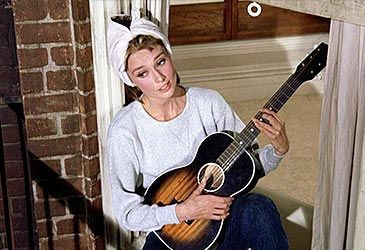 Audrey Hepburn performed 'Moon River' in which romantic comedy?