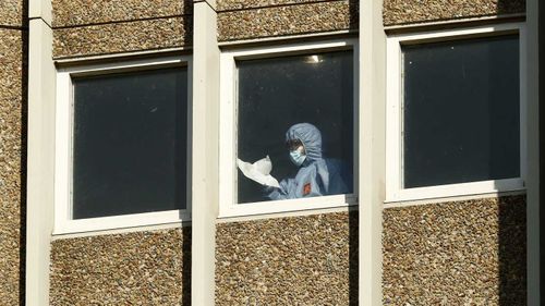 Cleaning takes place inside the Alfred Street Public Housing Complex in North Melbourne.