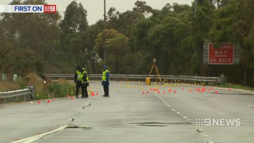 Forensic officers at the scene. (9NEWS)
