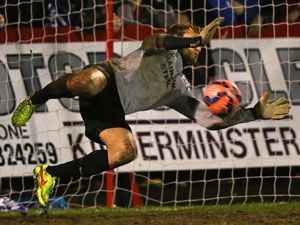 Sam Slocombe of Scunthorpe United saves a penalty. (Getty)