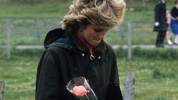 Diana, Princess of Wales, wearing a Barbour waxed jacket, holds a bouquet during a visit to Lochmaddy on July 4, 1985 in the Outer Hebrides, Scotland 