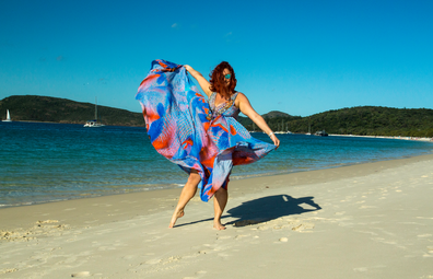 Woman in flowy dress on Whitehaven Beach