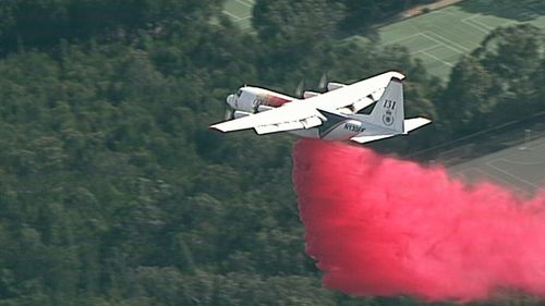 Flame retardant has been dropped on homes under threat with reports one is already alight near Canoon Road.