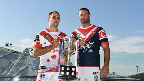 Dragons Player Jason Nightingale and Roosters Co-Captain Boyd Cordner with the ANZAC Day Trophy. (AAP)
