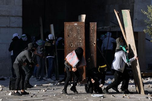 Palestinians clash with Israeli security forces at the Al Aqsa Mosque