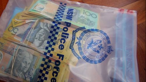 More than $30,000 in cash has been seized as part of an investigation into drug trafficking. 