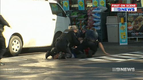 The man was tackled by police at the Thorngate service station. (9NEWS)