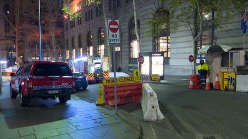 Firefighters rushed to salvage the building while police closed George Street outside. Picture: 9NEWS.