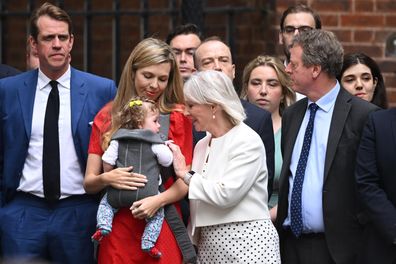 Secretary of State for Digital, Culture, Media and Sport, Nadine Dorries (C) speaks to Carrie Johnson and her child Romy outside 10 Downing Street on July 7, 2022 in London, England. 